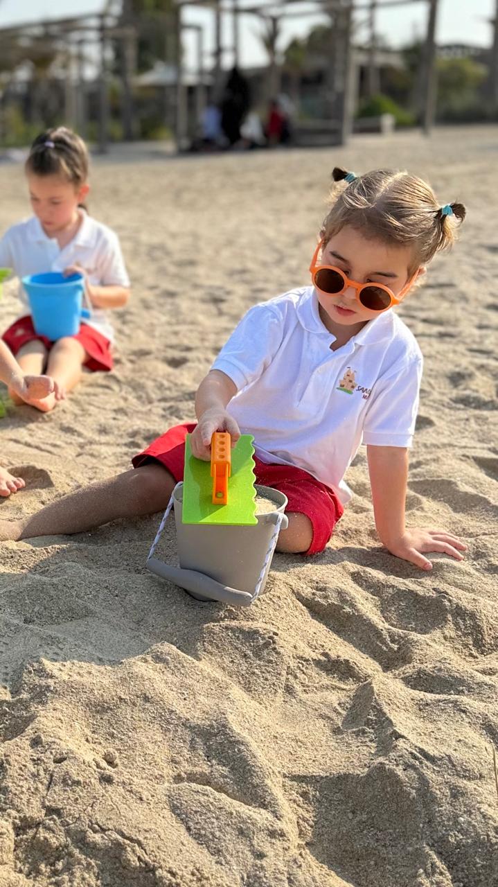 Sandcastle Nursery children playing on the beach