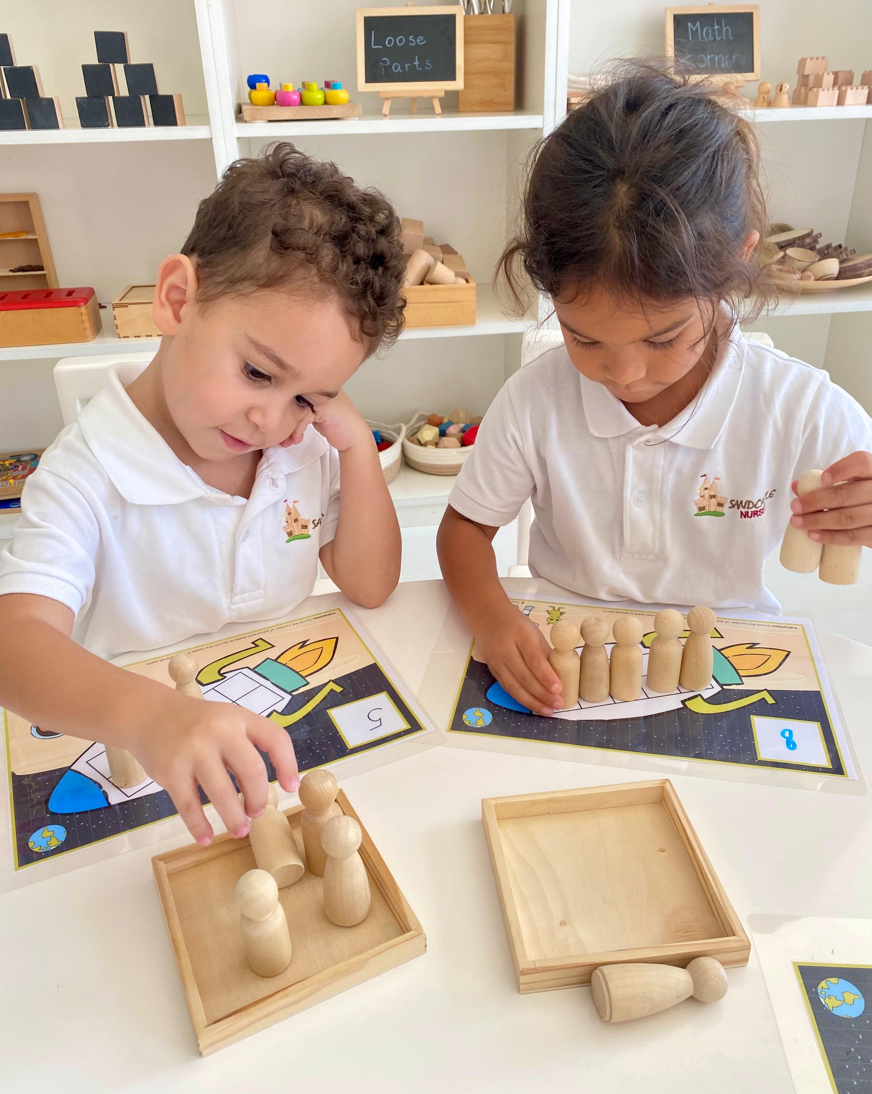Children learning with hands-on numeracy materials