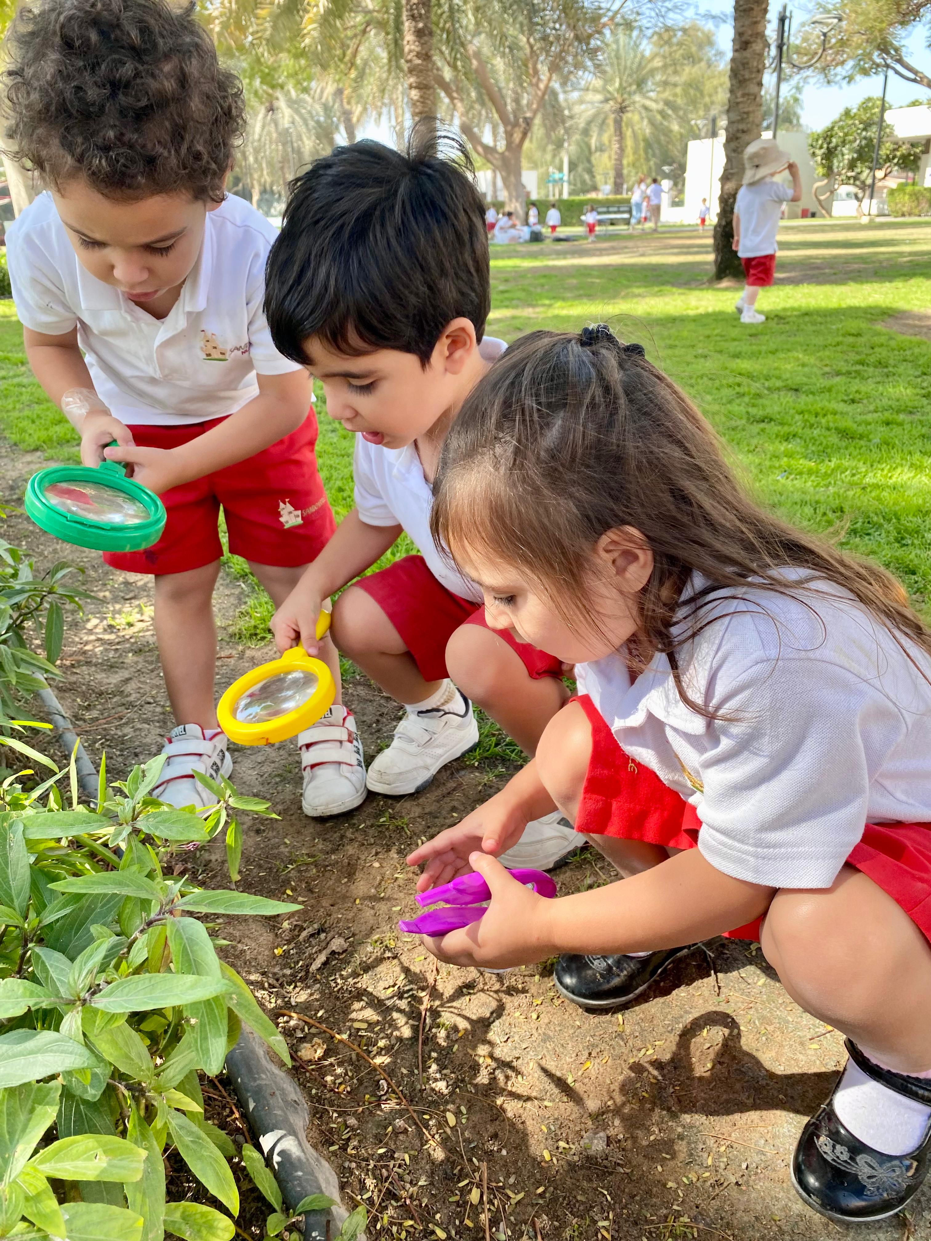 Children exploring plants outdoors