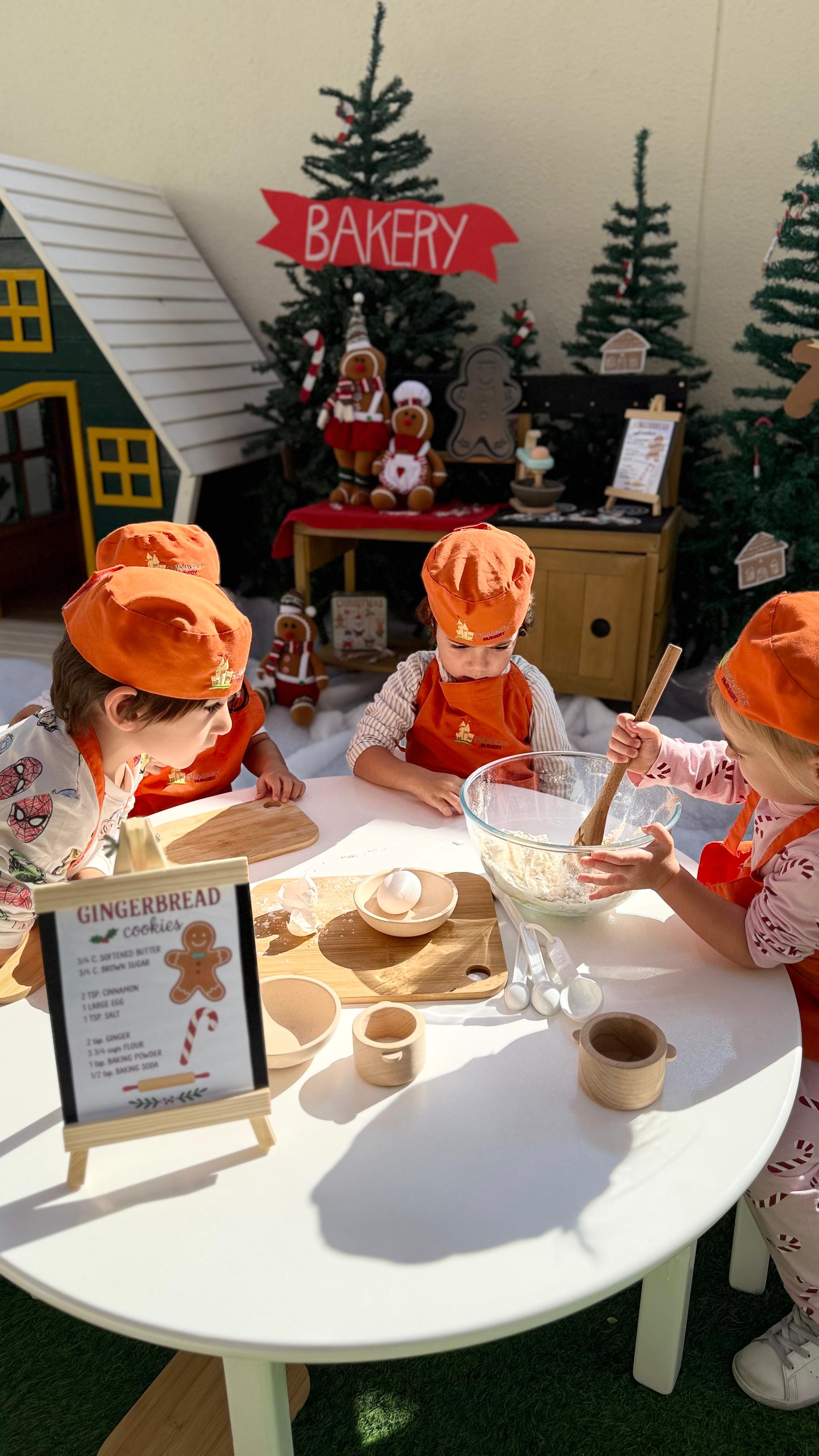 Children baking gingerbread cookies